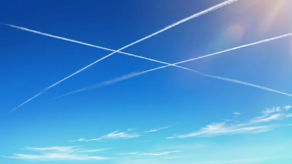 飛行機雲と空